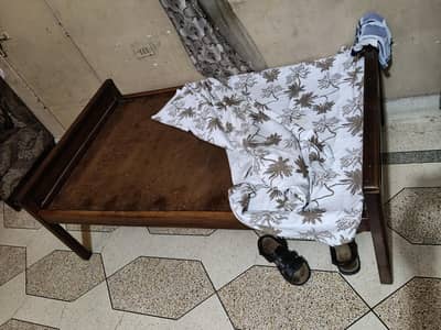 single wooden bed