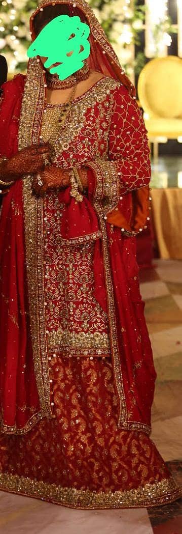 bridal dress condition 10/10 full heavy work with dark red color