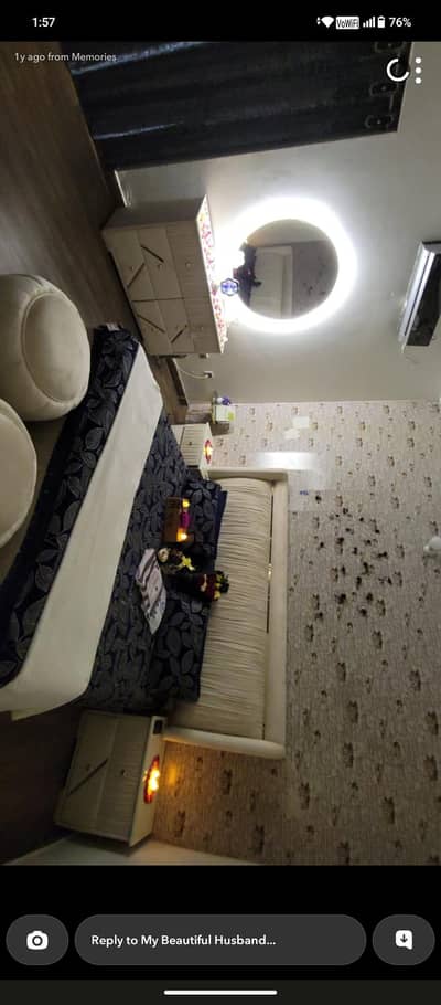 white poshish bed with side tables , dressing table and stools