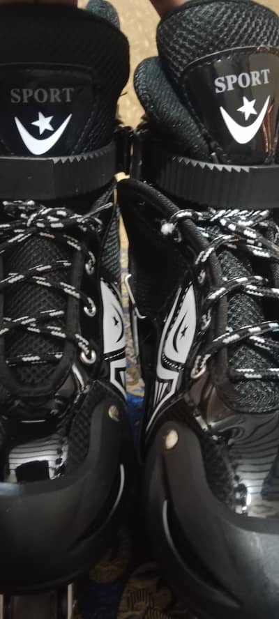 They feature a black soft-boot design with a contrasting silver alumin