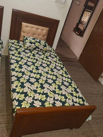2 single bed and 1 table