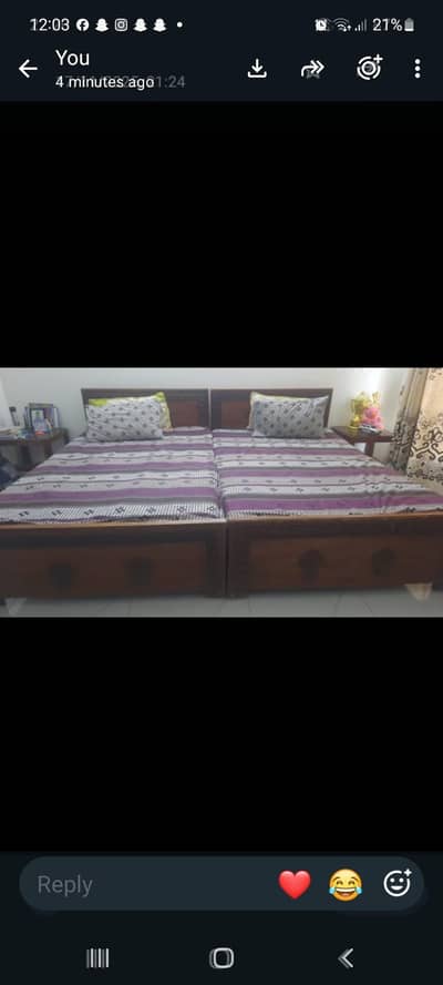 two single beds along with mattresses