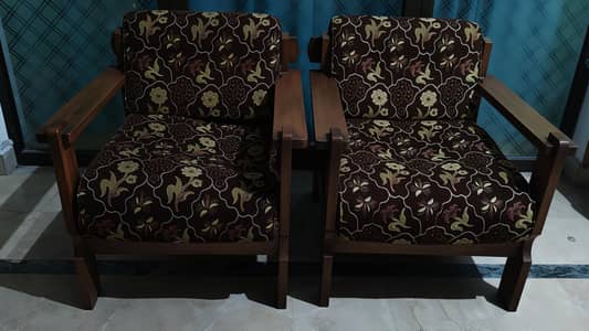 selling these 2 chairs fully wooden used negotiable