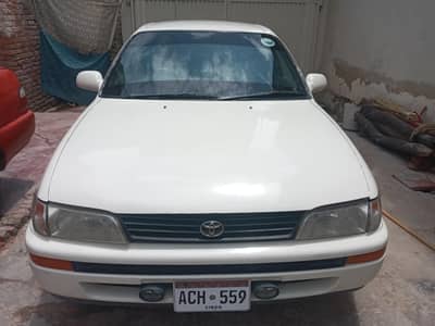 indus corolla 1999 model white colour alarm rim lpg