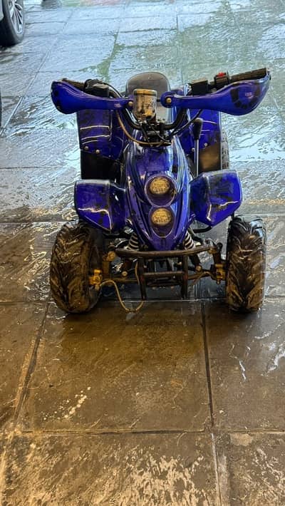 Quad bike with rugged offroad tires 70cc