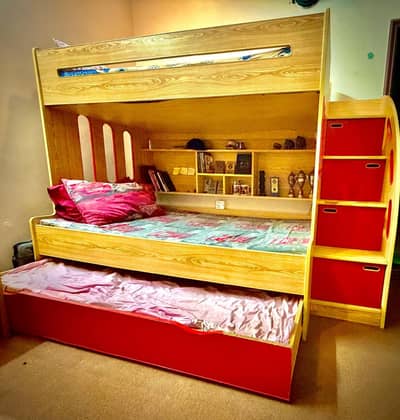 3 in one bunk bed set with study tables and book shelf.