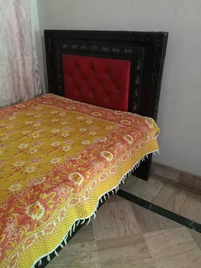 single wooden bed