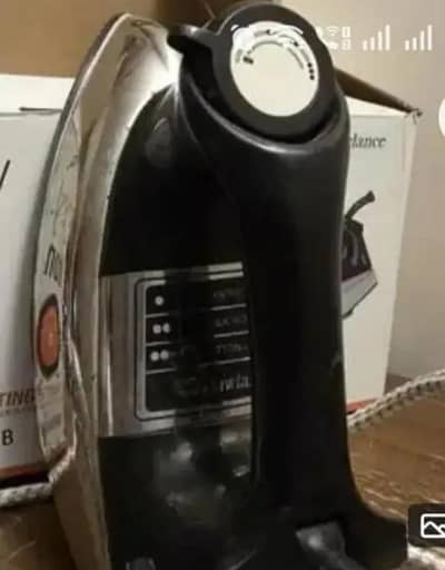 Great condition.  Black and silver coloured iron with box sale