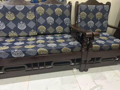 Dining table with chairs and sofa