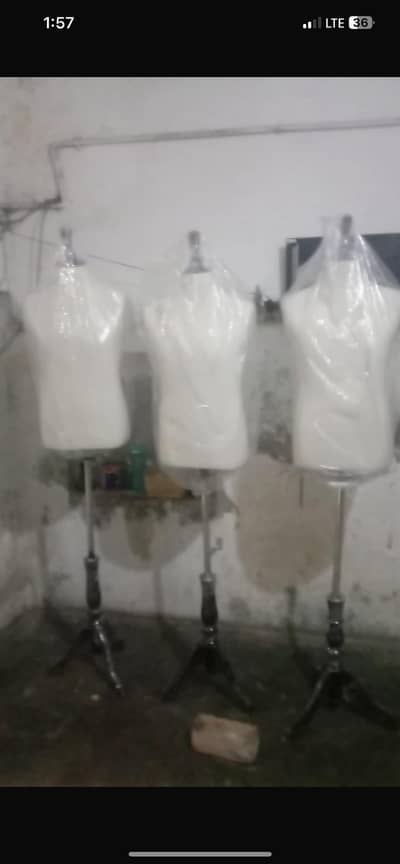 mannequins with adjustable steel tripod stand.