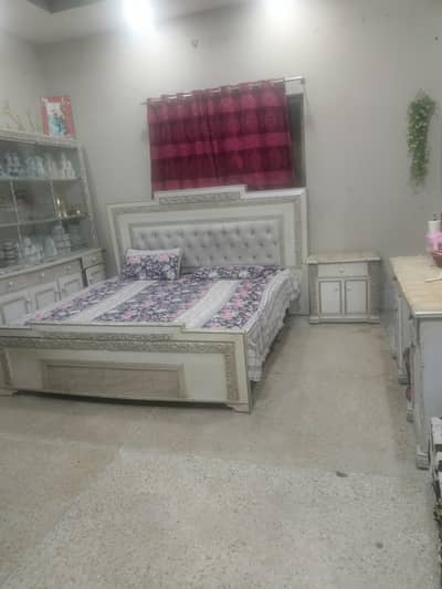 wooden bed with dressing showcase side table