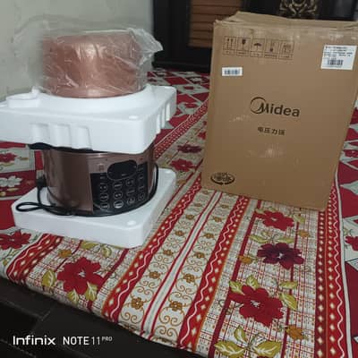 New Unused Midea Electric pressure cooker with multiple functions