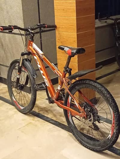 Red cycle with gears