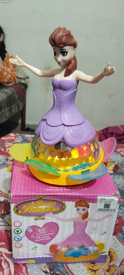 Used musical Doll toy. . battery cell lights. . almost new with box