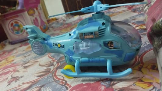 Used musical helicopter toy lights. . battery cell. . slight used labaik
