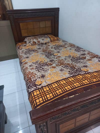 wooden bed with mattress