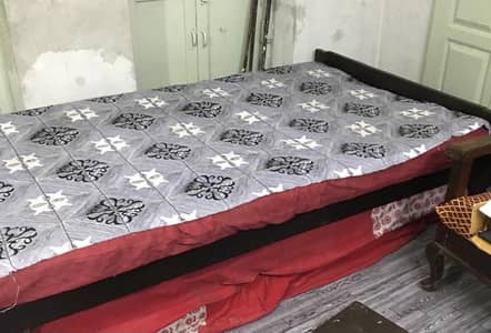2 wooden single bed
