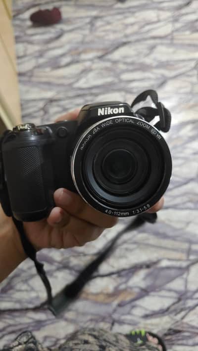 Nikon coolpix 28x zoom camera with Camelion original charger and cells