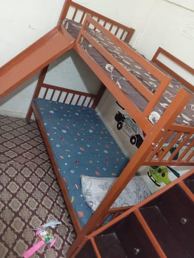 Bunk bed with slide , drawers, & 2 mattress