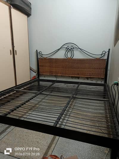 cane and iron bed