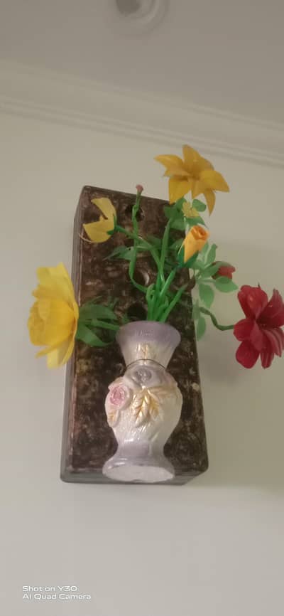 hand made flowers hang with wall and we also made new things