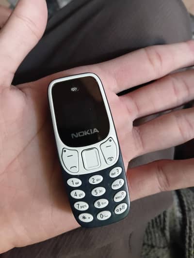 Mini Mobile 2 sims , 1memory card Nokia 10/10