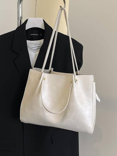 Cream Textured women's tote bag with gold Harware