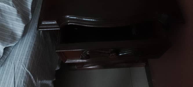 wooden bed without mattress
