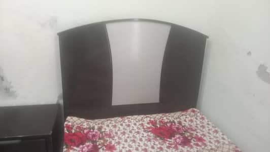 2 single bed with 1 center table and dressing