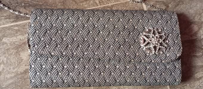 It's grey shiny clutch. Best for wedding purpose.