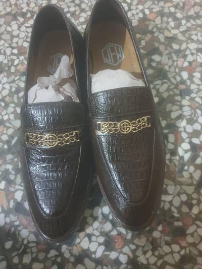 Selling brand new loafers in dark brown color