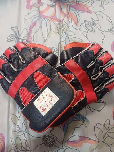 hardball keapering gloves with red and black color