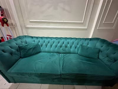 sofa set with table and curtain