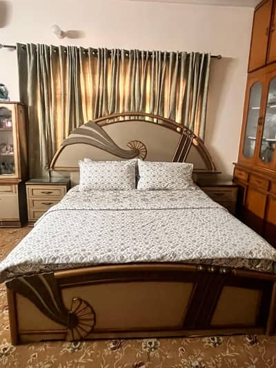 Wooden King bed with side tables and dressing