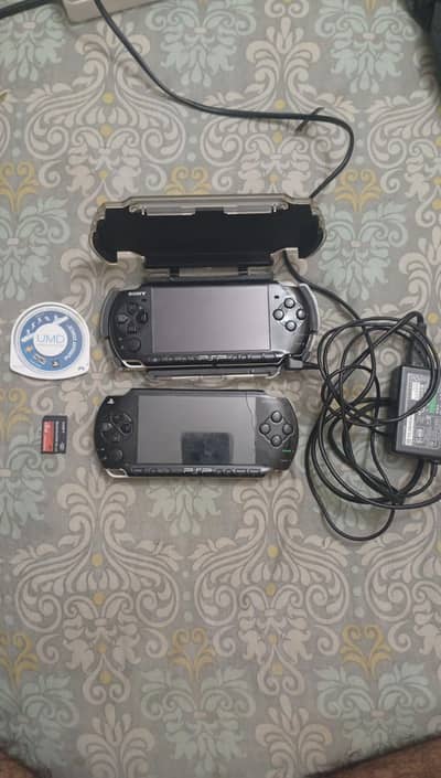 PSP 2 consoles with 2 memory cards with Games and CD