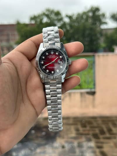 Rolex in red color. .