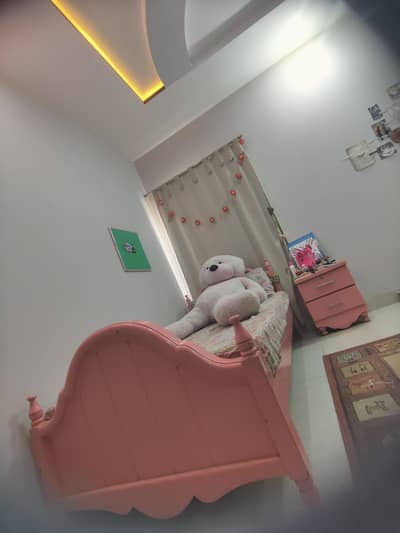 Set of 2 wooden pink beds with side tables