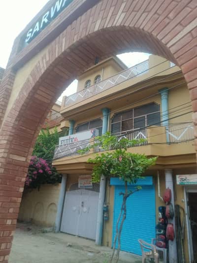 13 Marla Property (5 House Potions, 4 Shops) On Main Qadeer Road Rwp