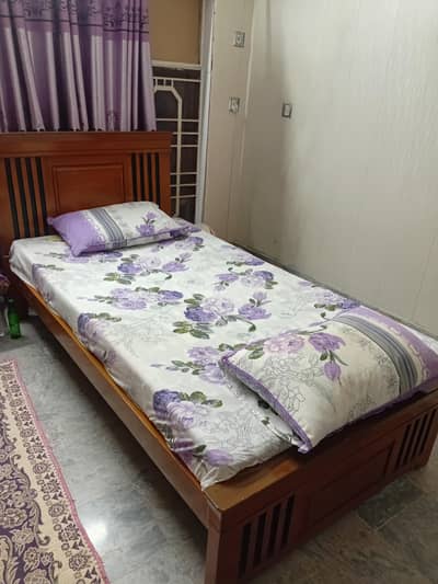 used wooden single bed.