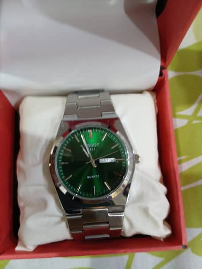 Tissot PRX watch in darck green dial