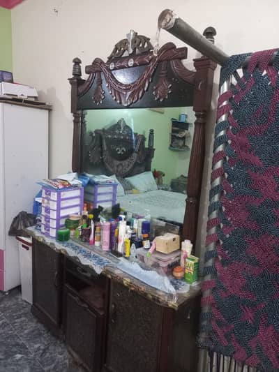 bed with spring mattress or drasing table