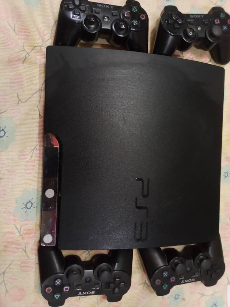 playstation 3 with 4 controllers 1
