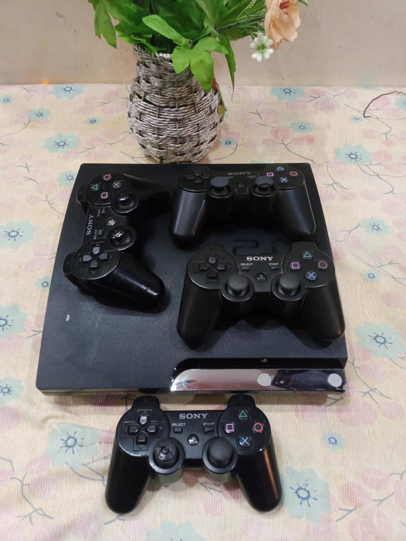 playstation 3 with 4 controllers 0