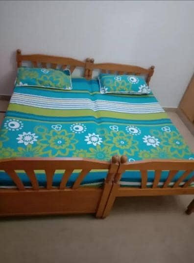2 single kids wooden beds and mattresses with 2 door wardrobe