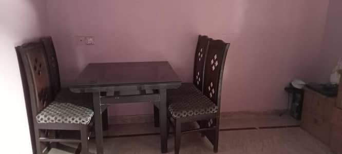 4-Seater Wooden Dining Table with Glass Top and Cushioned Chairs