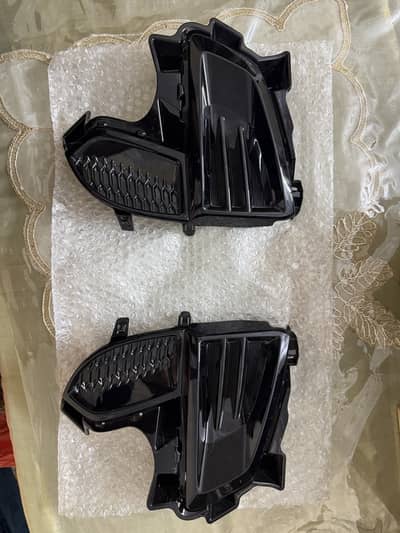 Original Front Bumper Fog Lamp Bezels / Covers (Pair)