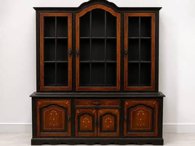 Elegant solid wooden vintage showcase with glass windows .