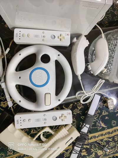 Nintendo Wii complete set-2 original remorts +Steering wheel +Nunchuks