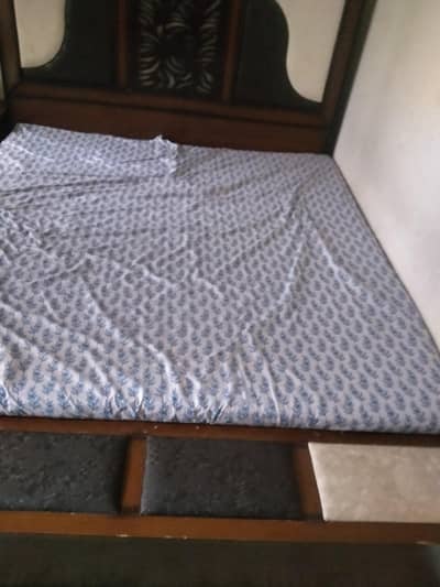 double bed with mattress and dressing table