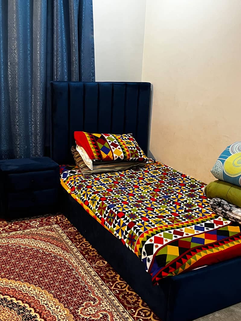 Two single bed sets with side tables 2